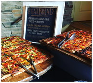 Flatbread pizzas on presentation display